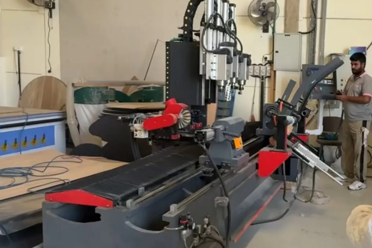 CNC multi-spindle drilling machine boring panel joints at the Olympic Furniture factory in Dubai