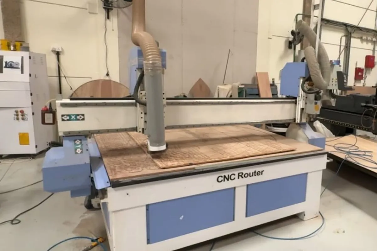 CNC router machining a board panel at the Olympic Furniture factory in Dubai Industrial City