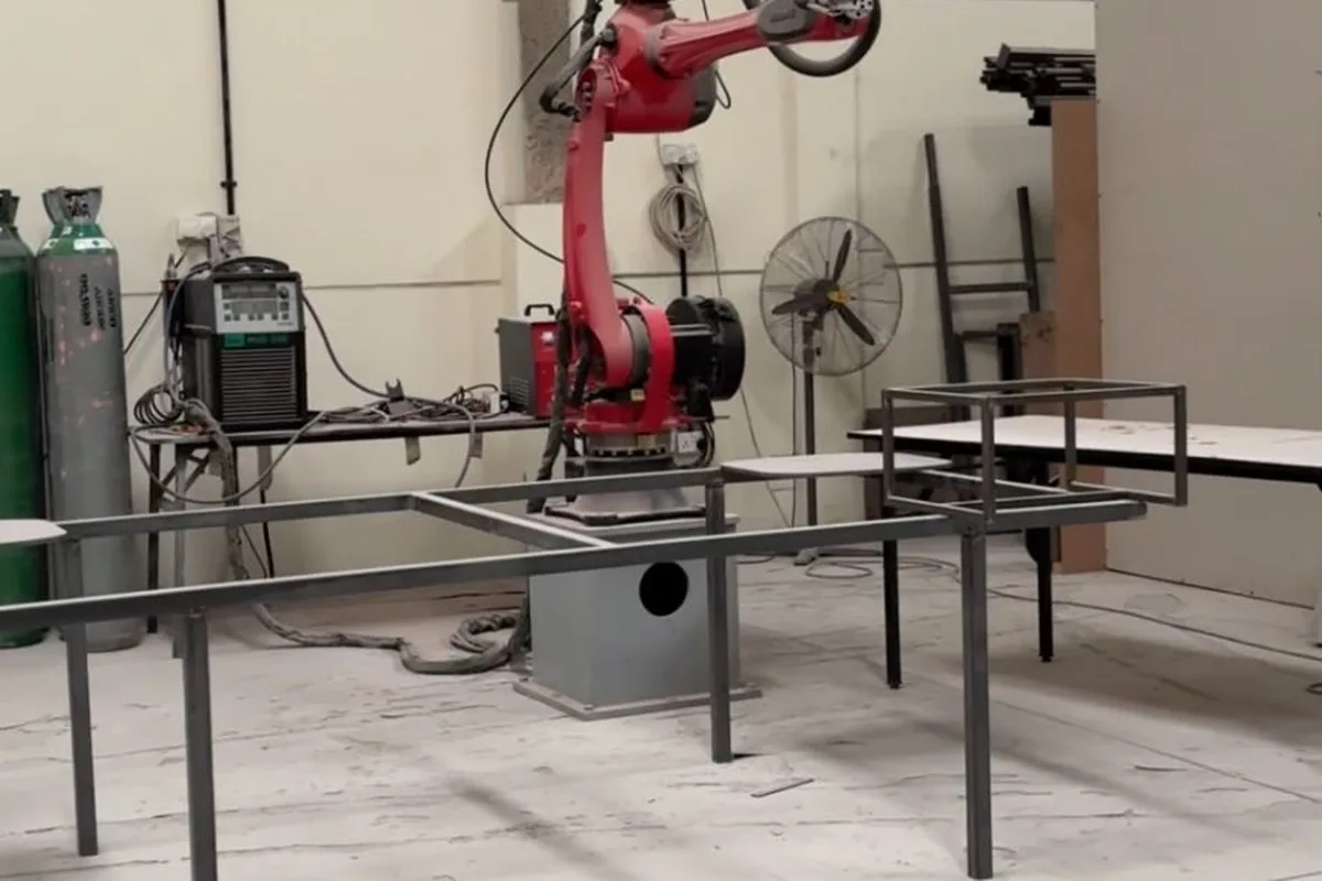 Robotic welding arm welding steel table and bed frames at the Olympic Furniture factory in Dubai